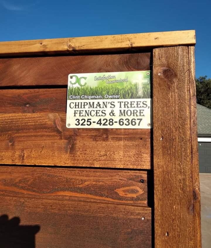 Chipman's Trees Fences and More business sign on cedar fence