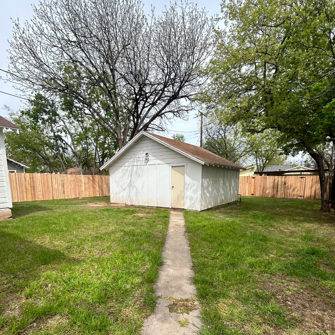 Cedar fence enclosing backyard